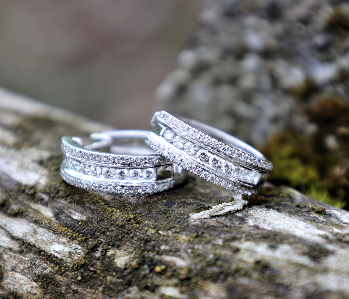 Luxury white gold diamond hoop earrings on natural stone