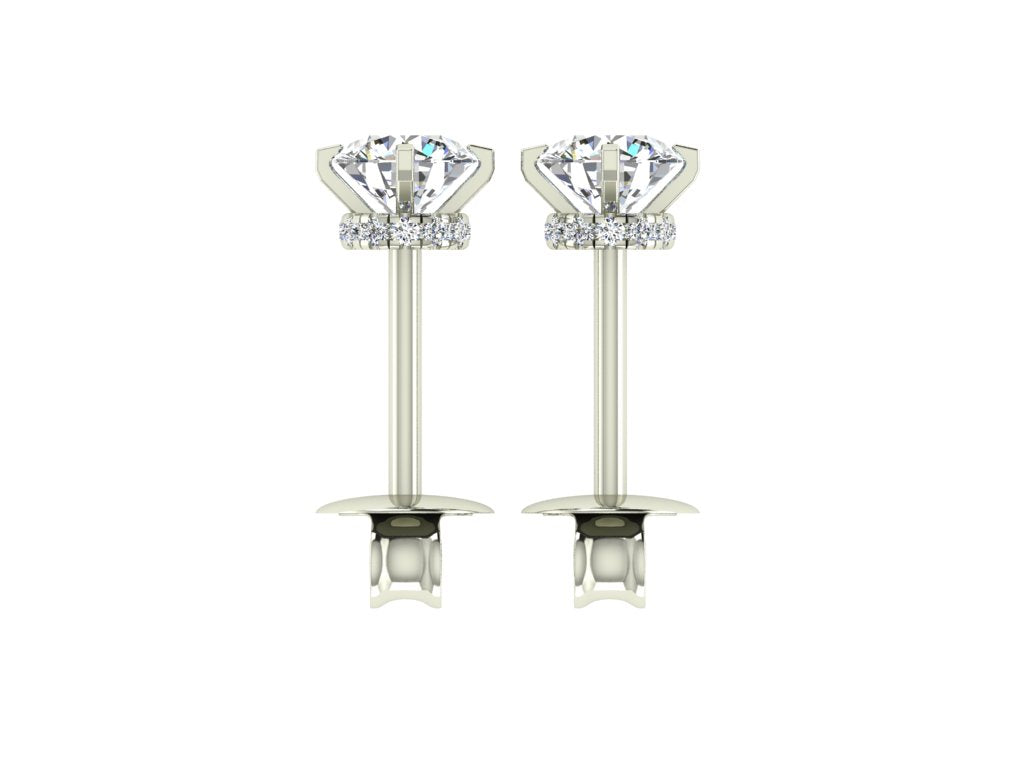  Orecchini in oro bianco con diamanti solitari da 0,57 ct