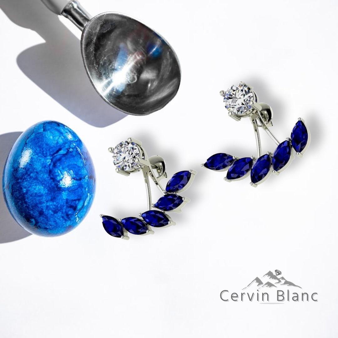 Boucles d'oreilles en or blanc serties de saphirs et de diamants.