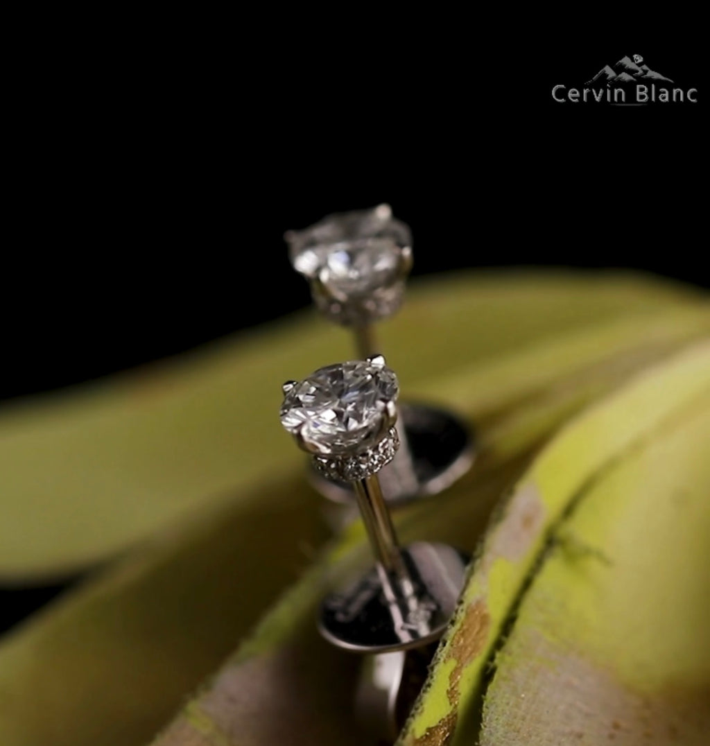  Orecchini in oro bianco con diamanti solitari da 0,57 ct