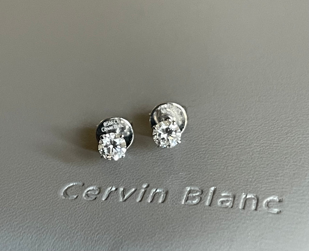  Orecchini in oro bianco con diamanti solitari da 0,57 ct