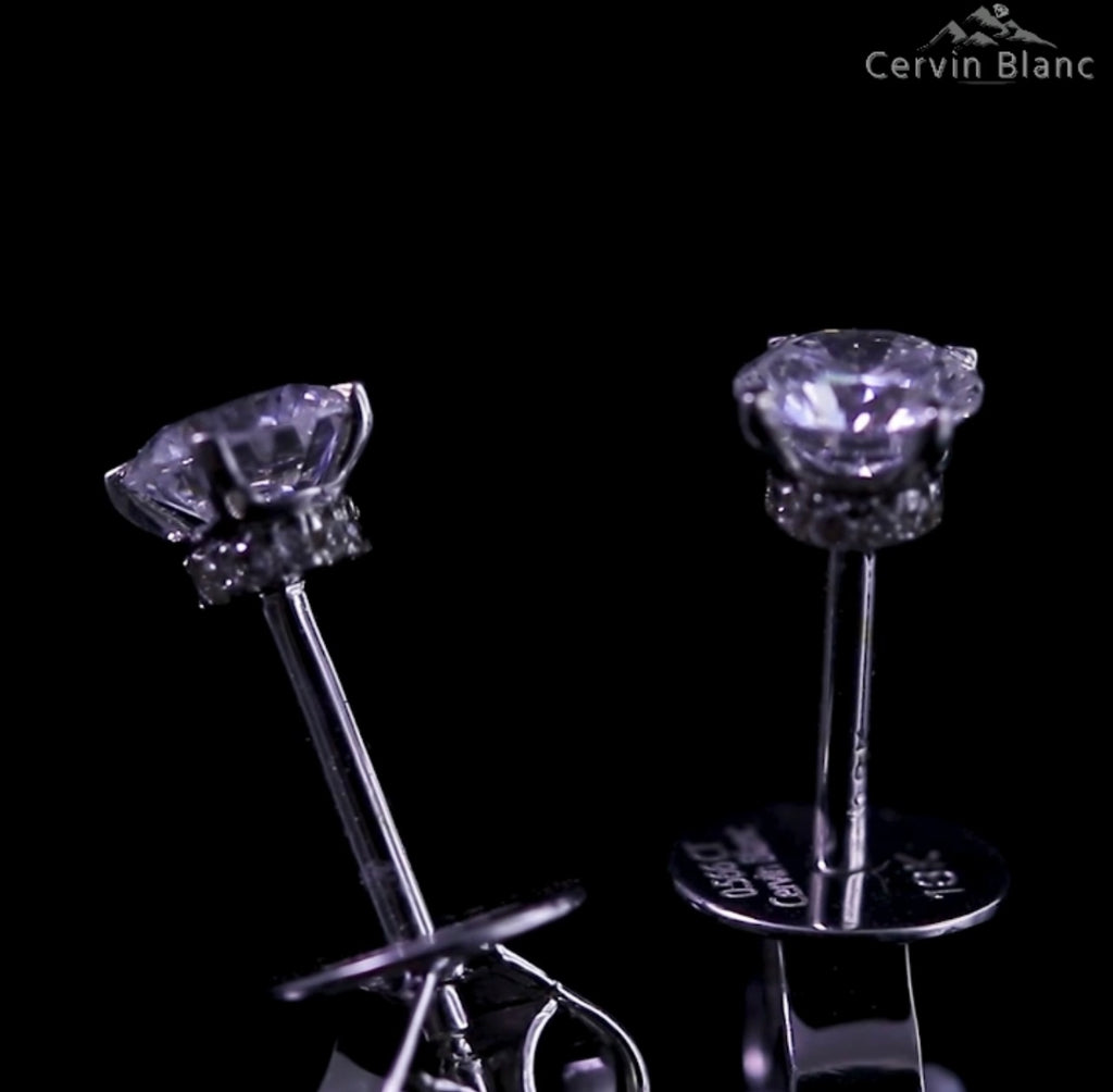  Orecchini in oro bianco con diamanti solitari da 0,57 ct