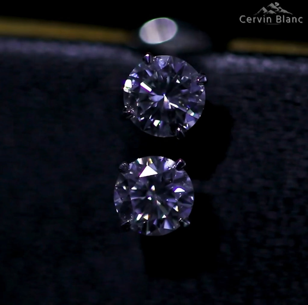  Orecchini in oro bianco con diamanti solitari da 0,57 ct