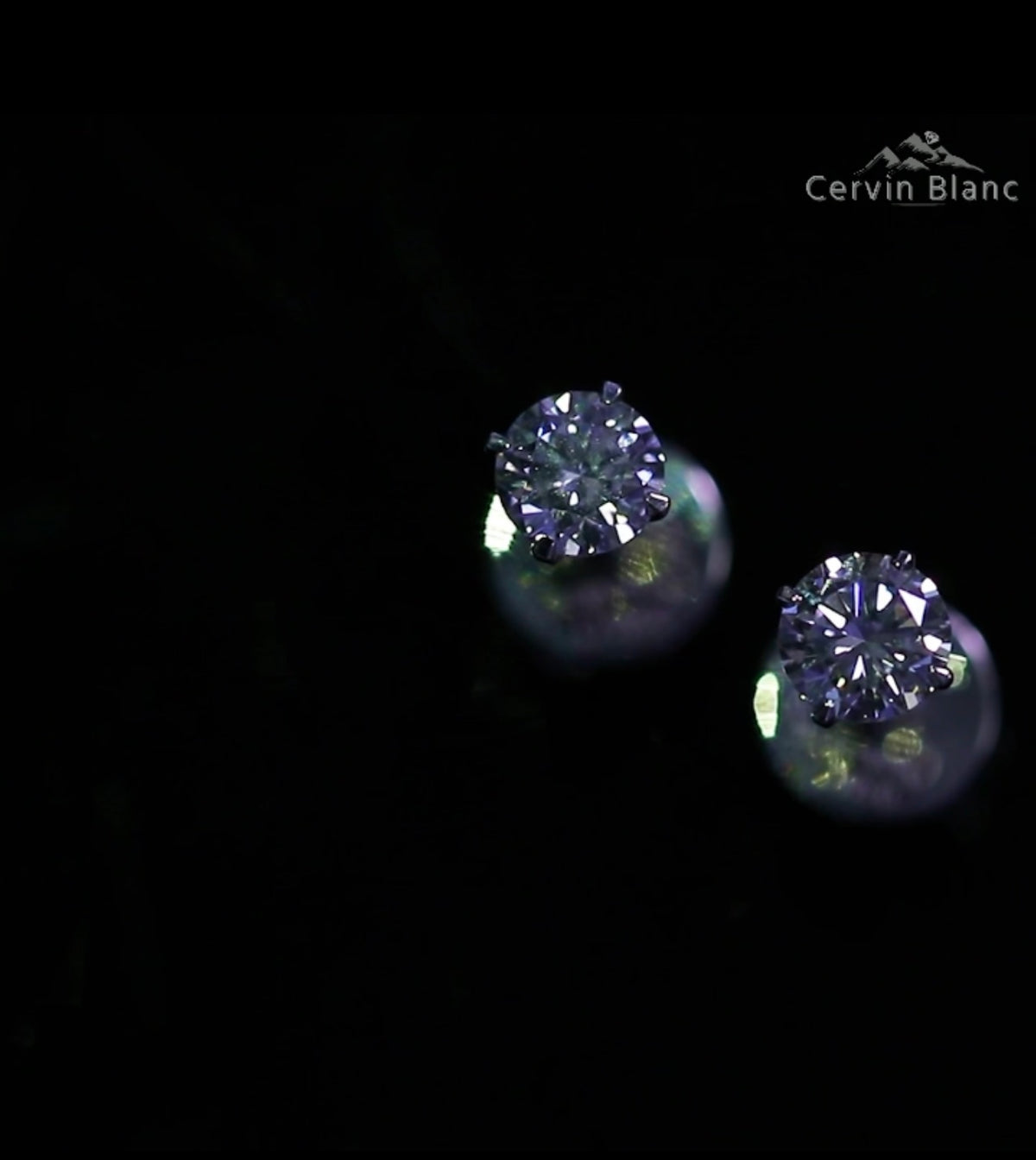  Orecchini in oro bianco con diamanti solitari da 0,57 ct