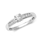 DIAMOND SOLITAIRE WITH CHANNEL SET SHOULDERS RING IN 18CT WHITE GOLD