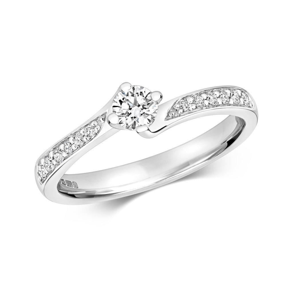 Bague solitaire en or blanc 18 carats, sertie griffes et pierres serties grainées.