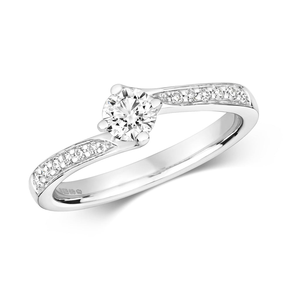 Bague solitaire en or blanc 18 carats, sertie griffes et pierres serties grainées.