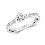 Bague solitaire en or blanc 18 carats, sertie de diamants solitaires à 6 griffes et sertie grainée sur les épaules.