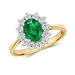  ANELLO A GRUPPO OVALE CON DIAMANTI E SMERALDI IN ORO 18KT